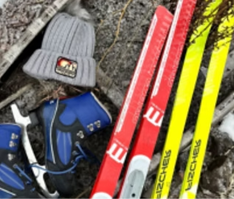 Cross-country skis, boots and a winter hat ready for North Shore ski trails