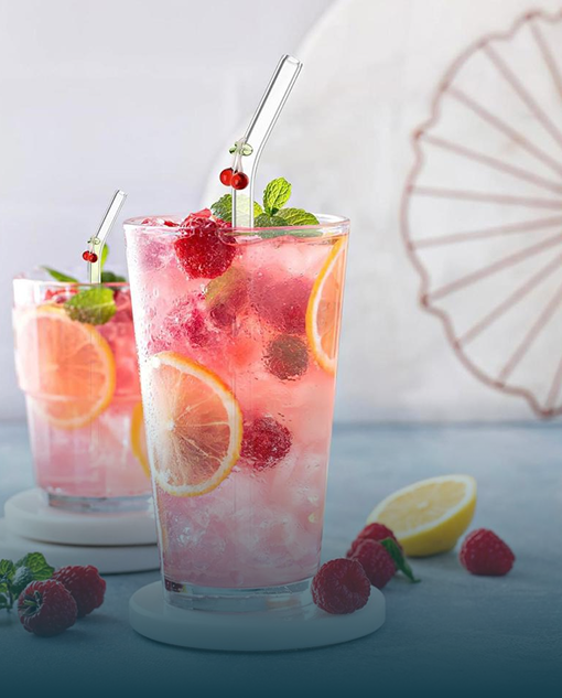 Iced raspberry lemonade drinks with fresh fruit and mint