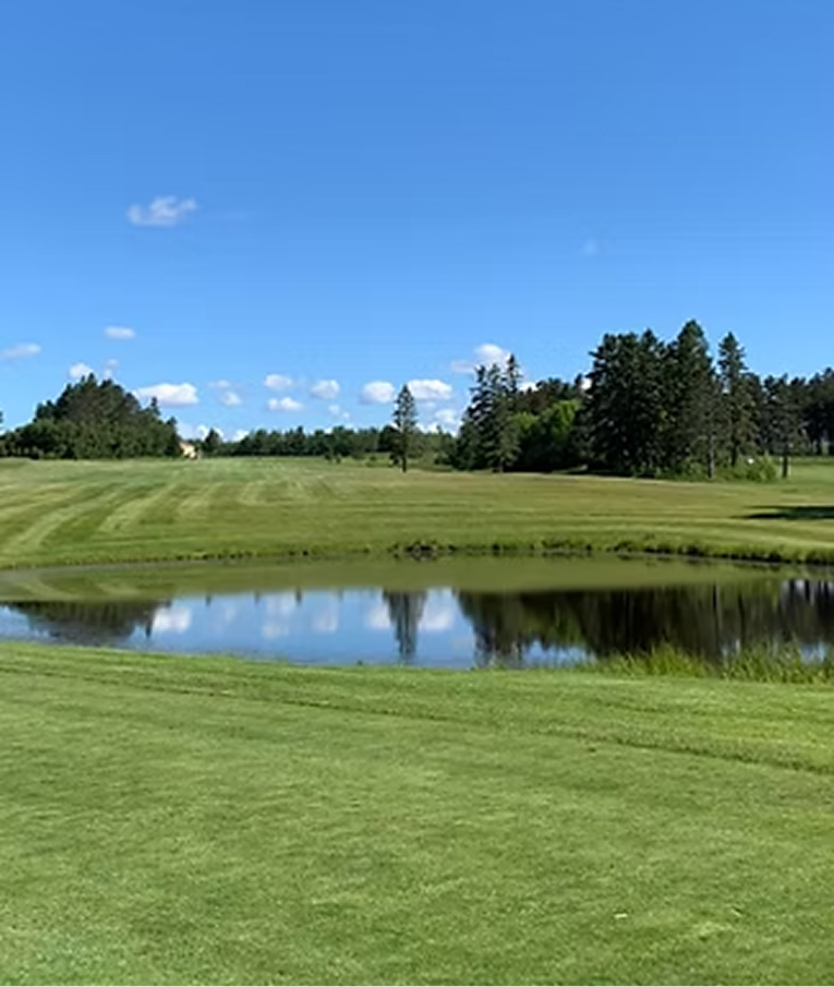 Golf course fairway and pond on a sunny summer day near Two Harbors